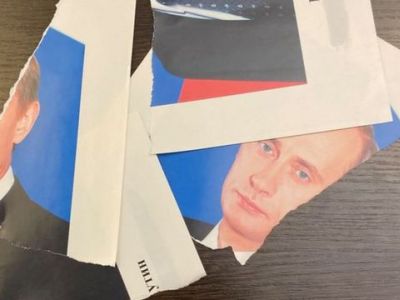 Разорванный портрет Путина